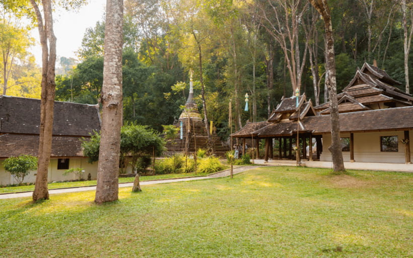Chiang Mai: Doi Suthep Temple and Waterfall by Songtaew Trio - Doi Suthep at eye level: relic, temple steps, and panoramic views
