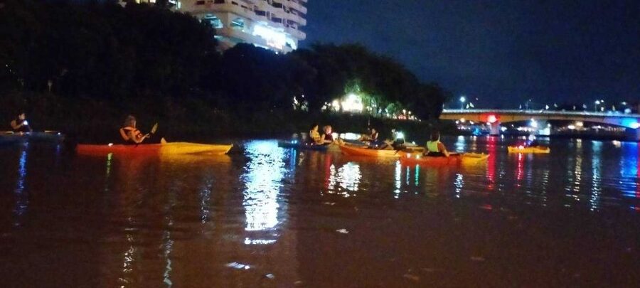 Chiang Mai: Ping River Night Kayaking into City Center - Mai Yai trees, riverbank homes, and music drifting from the shore