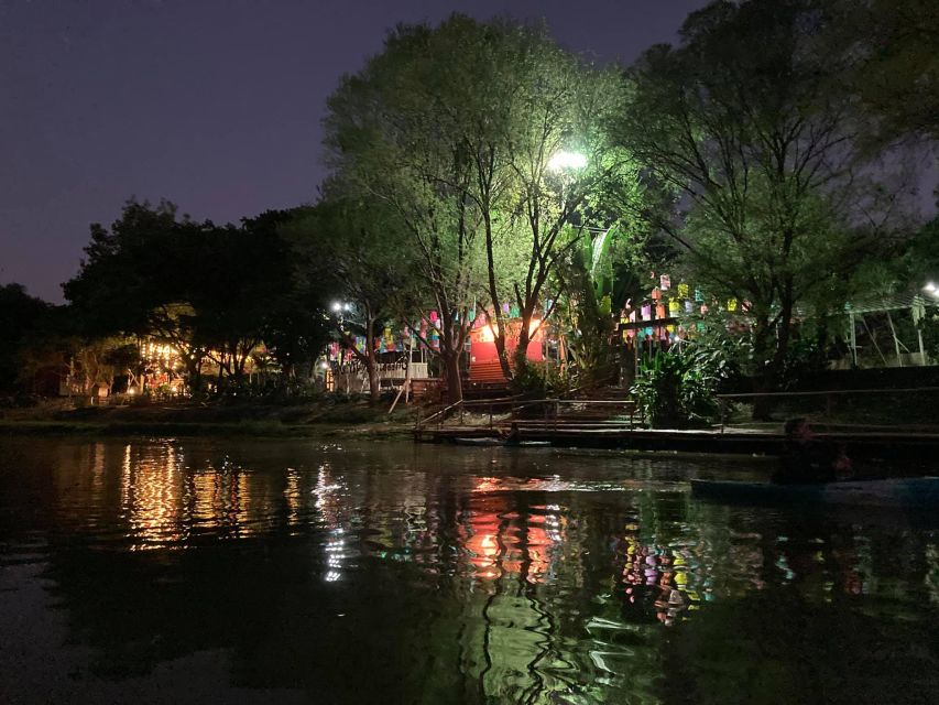 Chiang Mai: Ping River Night Kayaking into City Center - Transition into the city: Nawarat Bridge and the glow from the water
