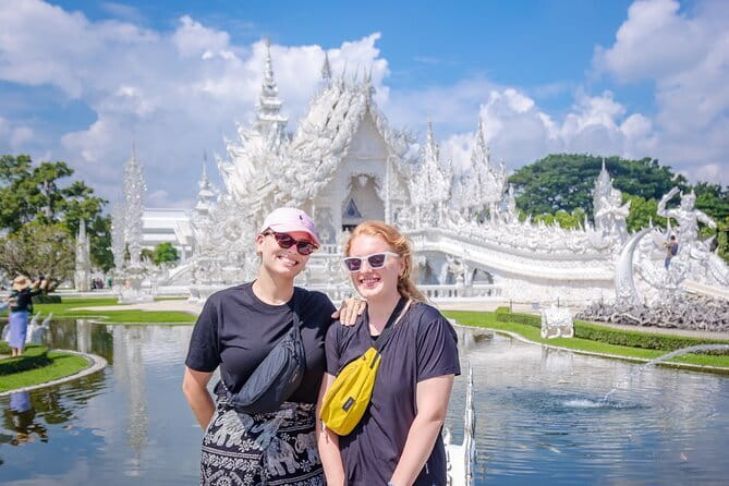 Chiang Rai White Blue Red Temples with Hot Spring from Chaing Mai - Wat Rong Khun White Temple: the mirrors, the symbolism, and the crowd factor