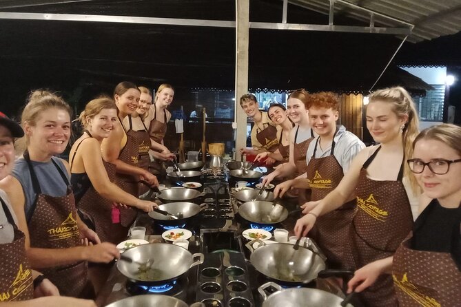 Cooking class in organic garden and local market tour ThaiCottage - The cooking setup: family-style kitchen, your own station