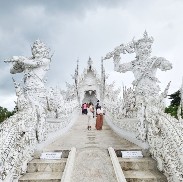 From Chiang Mai: Chiang Rai's Temples Exploration Day Trip - Wat Rong Khun White Temple: mirrors, pond reflections, and what to look for