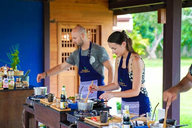Full-Day Thai Cooking Class with Grandma - Market and Farm Tour - Open-air kitchen setup, your own station, and small-group flow