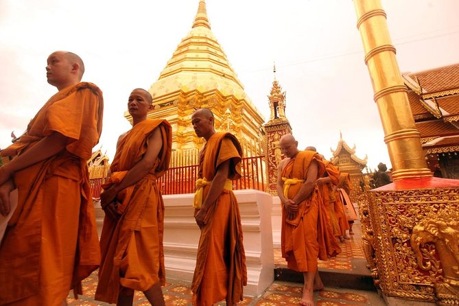 Wat Umong and Doi Suthep Temples Evening Tour - Doi Suthep sunset views: the 309 steps, Golden Pagoda sights, and the mood shift